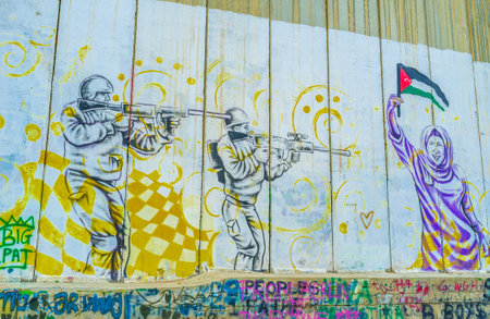 BETHLEHEM, PALESTINE - FEBRUARY 18, 2016: The mural that depicting Israeli - Palestinian conflict on the separation wall, on February 18 in Bethlehem.のeditorial素材