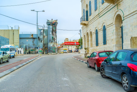 BETHLEHEM, PALESTINE - FEBRUARY 18, 2016: The damaged tower of separation wall in Bethlehem, on February 18 in Bethlehem.のeditorial素材