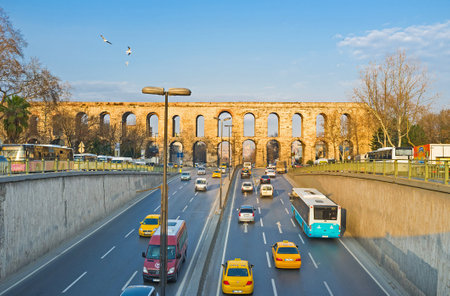 ISTANBUL, TURKEY - JANUARY 21, 2015: The Ataturk Boulevard passes under the arches of the ancient Valens Aqueduct, on January 21 in Istanbul.のeditorial素材