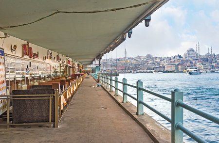 ISTANBUL, TURKEY - JANUARY 21, 2015: The Galata vridge is the nice place for fishing, enjoy the city vews and relax in the local cafe or fish restaurant, on January 21 in Istanbul.のeditorial素材
