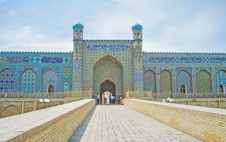 KOKAND, UZBEKISTAN - MAY 6, 2015: The central portal of the Palace of Khudayar Khan is richly decorated with the arabic calligraphy and islamic patterns, made on the blue glazed tiles, on May 6 in Kokand.のeditorial素材