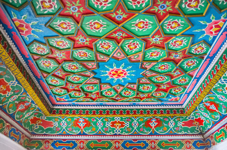 KOKAND, UZBEKISTAN - MAY 6, 2015: The carved stars on the room's ceiling in Khudayar Khan Palace boasts the variety of shapes and patterns, on May 6 in Kokand.のeditorial素材