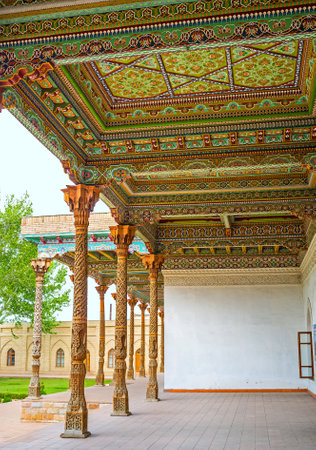 KOKAND, UZBEKISTAN - MAY 6, 2015: The wooden canopy in the courtyard of the Jami Mosque covered with colorful arabesques, on May 6 in Kokand.のeditorial素材