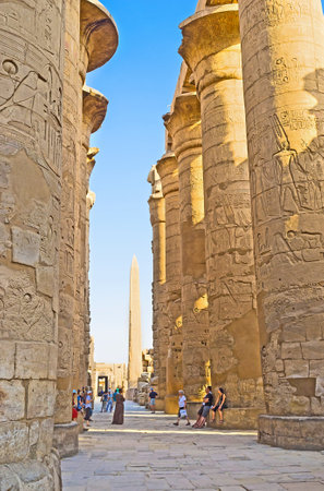 LUXOR, EGYPT - OCTOBER 7, 2014: The huge columns of the Hypostyle Hall in Karnak Temple covered with the ancient reliefs with hieroglyphs and stories about Gods and Pharaohs, on October 7 in Luxor.のeditorial素材