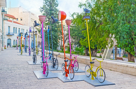JERUSALEM, ISRAEL - FEBRUARY 18, 2016: The urban installation in Safra Square in front of the City Hall, consists of the numerous colorful cycles, on February 18 in Jerusalem.のeditorial素材