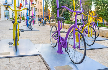 JERUSALEM, ISRAEL - FEBRUARY 18, 2016: The rows of colorful cycles in Safra Square attract the...