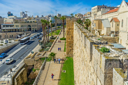 JERUSALEM, ISRAEL - FEBRUARY 18, 2016: The medieval ramparts separate the historical districts of the walled city from the modern neighborhoods, on February 18 in Jerusalem.のeditorial素材