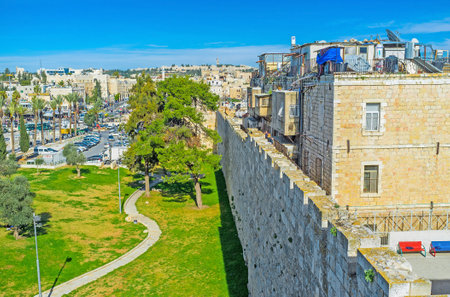 JERUSALEM, ISRAEL - FEBRUARY 18, 2016: The tiny green Hapninim Garden, located between New and Damascus Gates, is the nice place to relax and enjoy the weather, on February 18 in Jerusalem.のeditorial素材