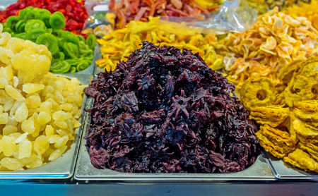 The candied hibiscus flowers and dried fruits in the stall of Mahane Yehuda Market, Jerusalem, Israel.の写真素材