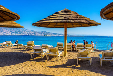 EILAT, ISRAEL - FEBRUARY 23, 2016: The beache of Eilat are very comfortable, they are equipped by...