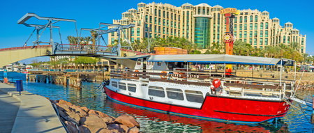 EILAT, ISRAEL - FEBRUARY 23, 2016: The pleasure boat moored next to the entrance to Marina in the...