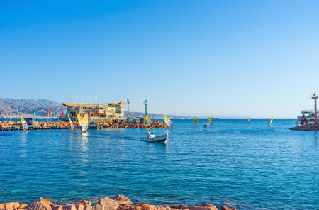 EILAT, ISRAEL - FEBRUARY 23, 2016: The windsurf boards next to the Sailing Club in harbor after the...