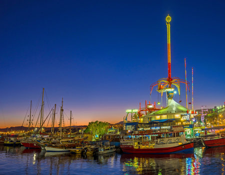 EILAT, ISRAEL - FEBRUARY 24, 2016: The amusement park becomes one of the brightest, noisiest and colorful places in the evening, on February 24 in Eilat.のeditorial素材