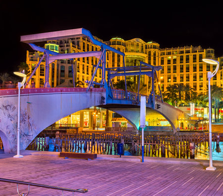 EILAT, ISRAEL - FEBRUARY 24, 2016: The evening view of the Memorial drawbridge and the luxury hotel...