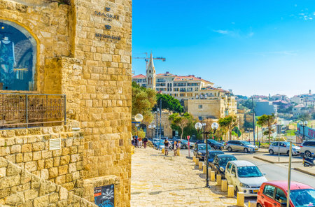TEL AVIV, ISRAEL - FEBBRUARY 25, 2016: The medieval Segev descent leads to the port and St George church with high bell tower, on February 25 in  Tel Aviv.のeditorial素材