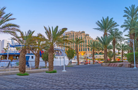 The evening is the perfect time for the lazy walks in scenic streets of Eilat, Israel.