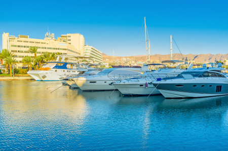 The central marina is full of luxury yachts, sailing ships and small fishing boats, Eilat, Israel.のeditorial素材