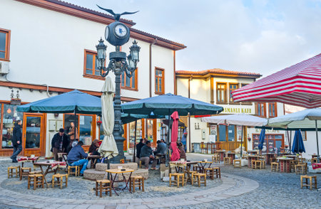 ANKARA, TURKEY - JANUARY 16, 2015: The  cozy outdoor teahouse in the city center, where  locals like to spend their time, drinking tea, coffee and smoking, on January 16 in Ankara.のeditorial素材