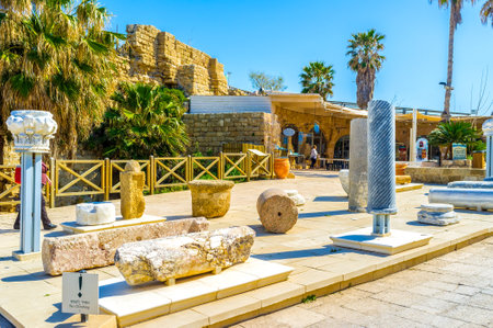 CAESARIA, ISRAEL - MAY 19, 2016: The exhibition of the stone columns' remains in front of the local restaurant, on May 19 in Caesaria.のeditorial素材