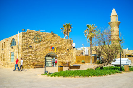 CAESARIA, ISRAEL - MAY 19, 2016: The medieval mosque, surrounded by cafes, taverns, souvenir stores and art galleries and craft centers of the open air museum, on May 19 in Caesaria.のeditorial素材