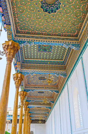 BUKHARA, UZBEKISTAN - APRIL 29, 2015: The row of arabic wooden screens, covered with colorful patterns and carvings in Sheikh Nakshbund Mausoleum, on April 29 in Bukhara.のeditorial素材