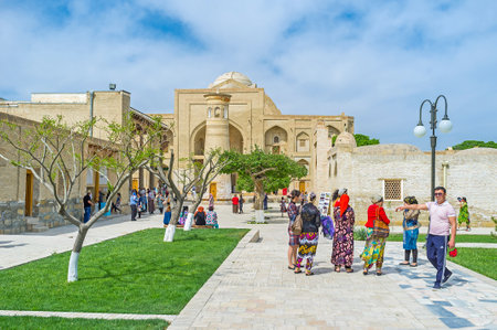 BUKHARA, UZBEKISTAN - APRIL 29, 2015: The pilgrims go to Khanaka of Abd Al-Aziz-Khan of Bahauddin...