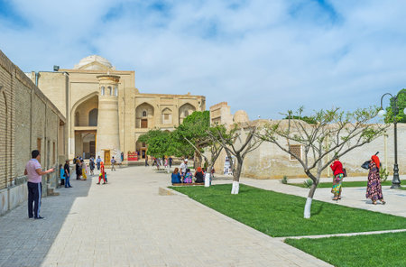 BUKHARA, UZBEKISTAN - APRIL 29, 2015: The small brick minaret in front of Abd Al-Aziz-Khan Khanaka of Bahauddin Nakshband Memorial Complex, on April 29 in Bukhara.のeditorial素材