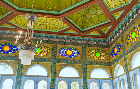 BUKHARA, UZBEKISTAN - APRIL 29, 2015: The small chamber with large glass windows and carved wooden ceiling in Sitorai Mokhi-Khosa Palace, on April 29 in Bukhara.のeditorial素材