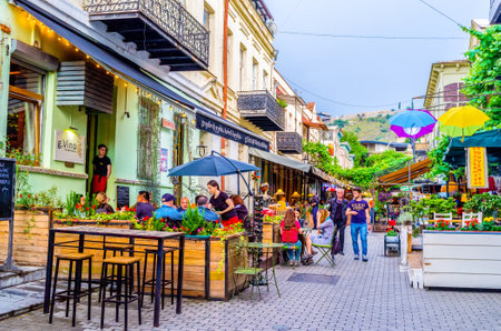 TBILISI, GEORGIA - MAY 28, 2016: The tourists enjoy the local cuisine on the summer terrace of cafe, on May 28 in Tbilisi.のeditorial素材