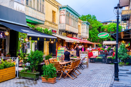 TBILISI, GEORGIA - MAY 28, 2016: The narrow streets boast the nice cafes and restaurants for each taste, on May 28 in Tbilisi.のeditorial素材