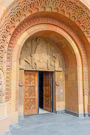 YEREVAN, ARMENIA - MAY 29, 2016: The entrance to the St Sarkis Cathedral decorated with the carved...