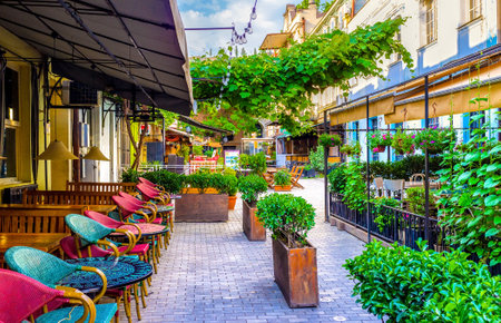 TBILISI, GEORGIA - MAY 28, 2016: The chairs in summer terrace are turned to the street and the visitors can watch the passers by, like in Paris cafes, on May 28 in Tbilisi.のeditorial素材