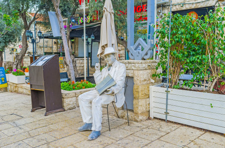 HAIFA, ISRAEL - FEBRUARY 20, 2016: The white mannequin with a menu advertises the restaurant of local cuisine, located in German Colony, on February 20 in Haifa.のeditorial素材