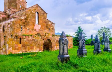 The black carved tombstones next to Odzun Basilica, Alaverdi, Armenia.の写真素材