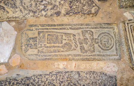 SANAHIN, ARMENIA - MAY 30, 2016: The medieval tombstone on the floor of Sanahin Monastery, decorated...