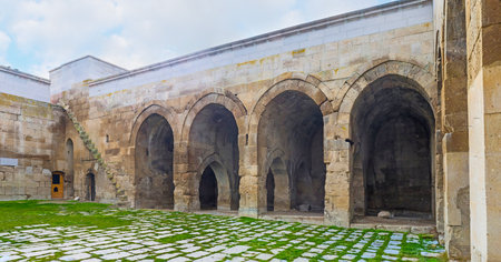 AGZIKARAHAN, TURKEY - JANUARY 19, 2015: The courtyard of the medieval Agzikarahan Caravan Saray with huge stone walls and warehouses for the storage of goods, on January 19 in Agzikarahan.のeditorial素材