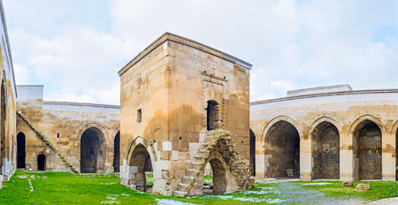 AGZIKARAHAN, TURKEY - JANUARY 19, 2015: The small mosque (mescit) in the middle of Agzikarahan Caravan Saray with the stairs, leading to the top floor, on January 19 in Agzikarahan.のeditorial素材