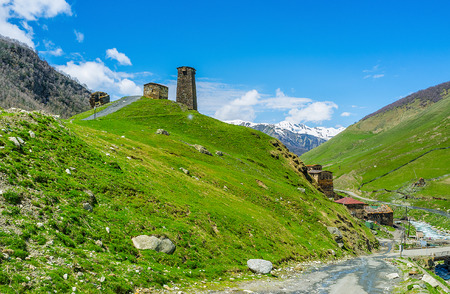 The stone Svan tower on the hill overlooks all the Ushguli comunity and mountain range around it,...