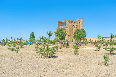 SHAKHRISABZ, UZBEKISTAN - MAY 2, 2015: The workers landscape a large park in the old city center,...