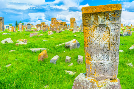 The carved patterns on the old khachkar with the cross crack in the middle of the stone block, Noratus Cemetery, Gegharkunik Province, Armenia.の写真素材