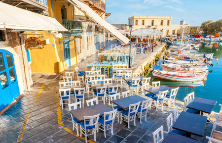 RETHYMNO, GREECE - OCTOBER 16, 2013: The old harbor can be named the gourmets' street, the local outdoor restaurants are the best in old town, on October 16 in Rethymno.のeditorial素材
