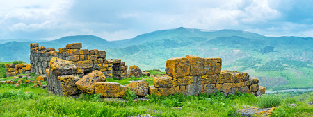 The bright yellow lichen on the old ruins makes them look like in gilt, Saro, Georgia.の写真素材