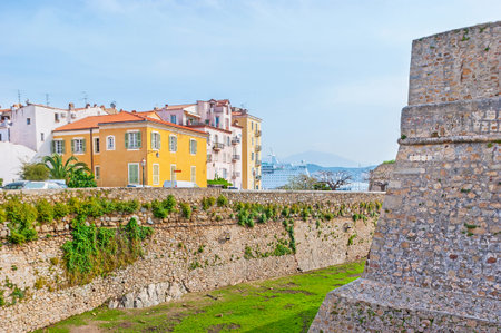 The rampart of the old Citadel, surrounded the colorful residential buildings and located adjacent to the port, Ajaccio, Corsica, France.のeditorial素材
