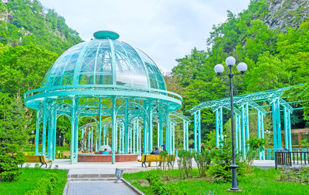 The blue pavilion with mineral water located in old park in narrow gorge, adjecent to Borjomula river, Borjomi, Georgia.のeditorial素材
