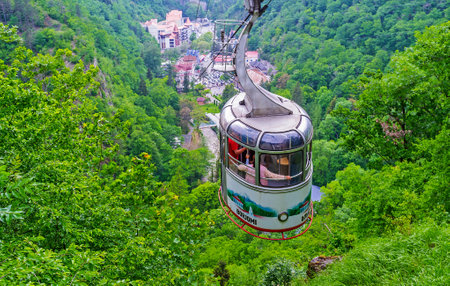 BORJOMI, GEORGIA - MAY 27, 2016: The aerial tram rides down from the upper Plateau Station to the mineral water park, located in green gorge, on May 27 in Borjomi.のeditorial素材
