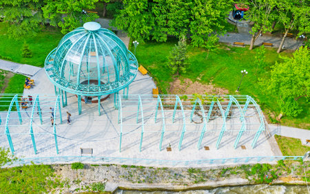 The Borjomi cable car rides over the Mineral Water Park with its blue pavilion, hiding the water source, Georgia.のeditorial素材