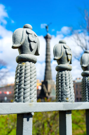 The Russo-Turkish War Memorial Column between the fence finials at the Trinity Cathedral in St Petersburg, Russia.のeditorial素材