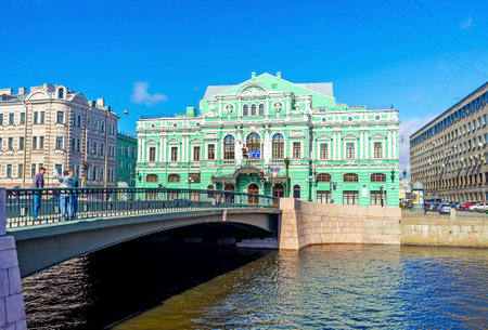 SAINT PETERSBURG, RUSSIA - APRIL 25, 2015: The Leshtukov Bridge across Fontanka River leads to the bright building of Tovstonogov Bolshoi Drama Theater (Great Dramatic), on April 25 in Saint Petersburg.のeditorial素材