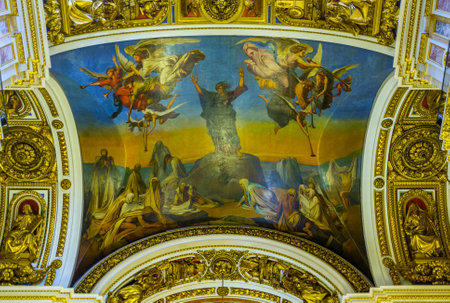 SAINT PETERSBURG, RUSSIA - APRIL 25, 2015: The icon on the ceiling of St Isaac's Cathedral, surrounded by fretwork patterns and sculptures, on April 25 in Saint Petersburg.のeditorial素材