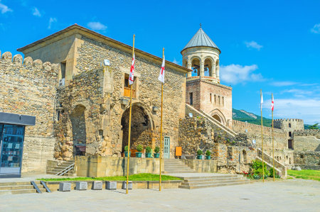 The main gate of Svetitskhoveli Cathedral with the beautiful bell tower on the background, Mtskheta,...